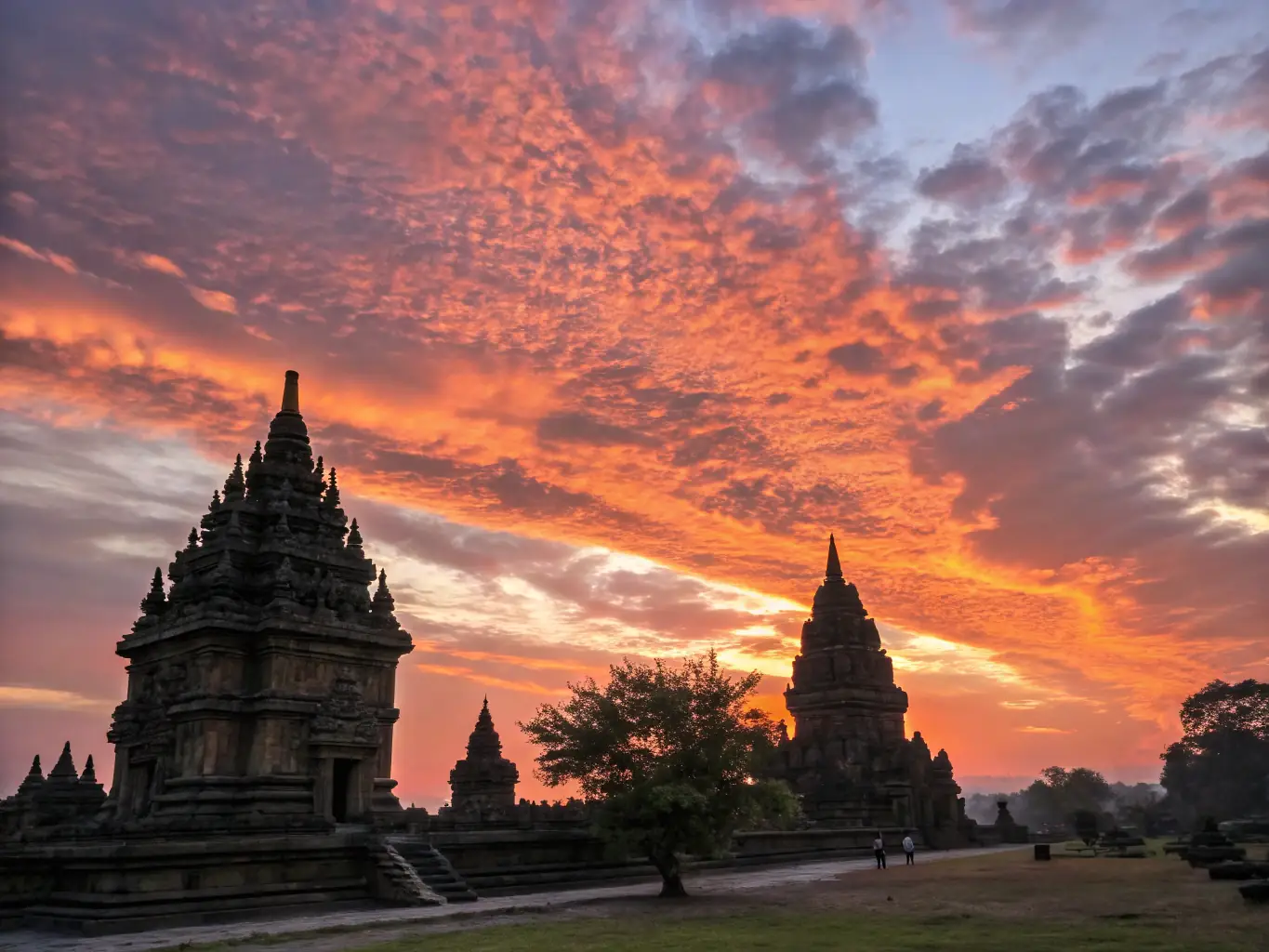 A peaceful image of a traditional Thai temple with monks in saffron robes, set against a backdrop of a vibrant sunset, representing the cultural and spiritual healing aspects of Thailand.